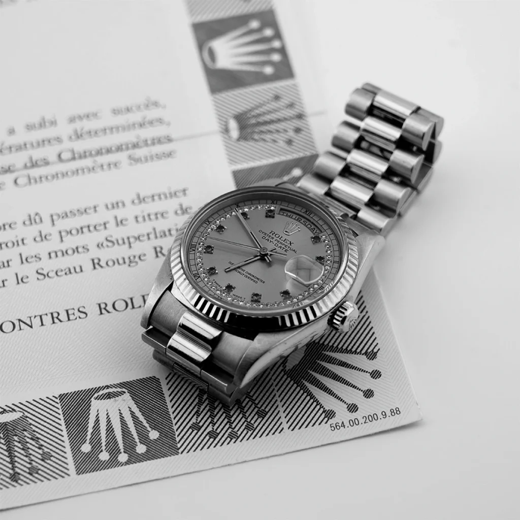 Orologio Rolex Day-Date su certificato di autenticità Chronomètre Suisse, certificazione beni Collecto